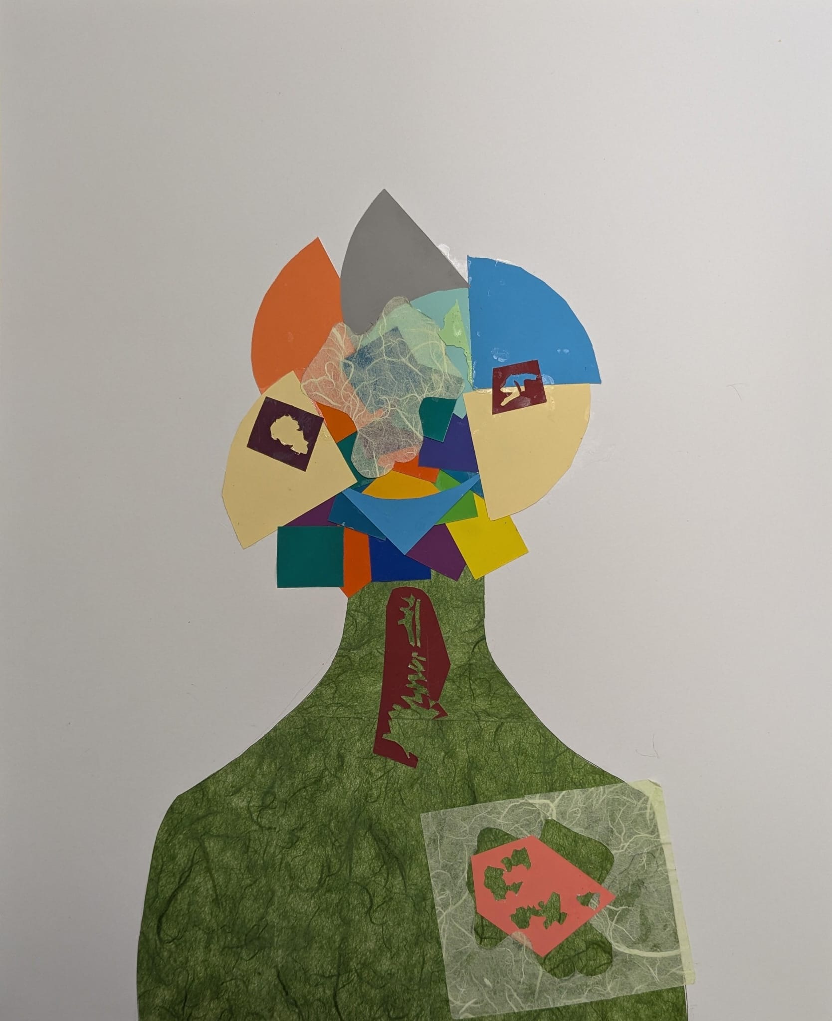 A colorful collage portrait assembled from layered geometric and patterned shapes